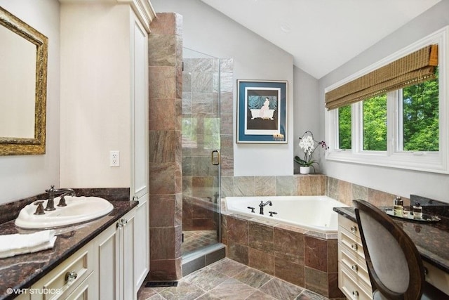 full bath featuring vanity, lofted ceiling, a bath, and a shower stall