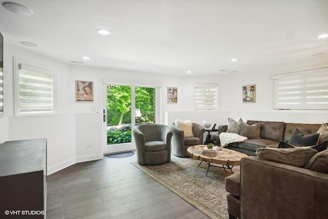 living area with recessed lighting, wood finished floors, and baseboards