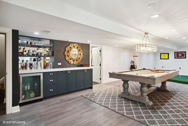 playroom featuring billiards, recessed lighting, a bar, wine cooler, and light wood-style floors