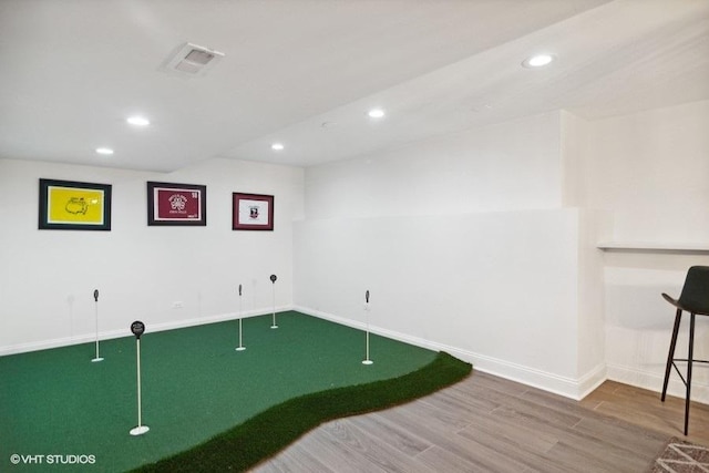 interior space with visible vents, recessed lighting, baseboards, and wood finished floors