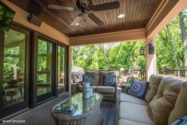 exterior space featuring outdoor lounge area and ceiling fan