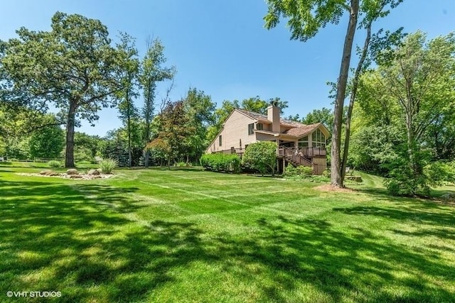 view of yard featuring stairway and a deck