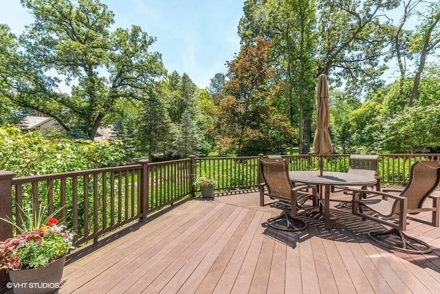 deck featuring outdoor dining area