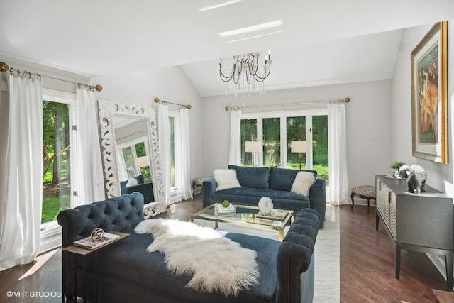 living room with lofted ceiling, dark wood-type flooring, and a chandelier