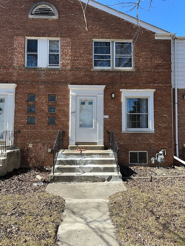 view of front of home featuring brick siding