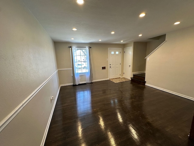 entryway featuring dark wood-style floors, recessed lighting, and baseboards