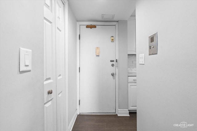 hallway with dark wood-style floors