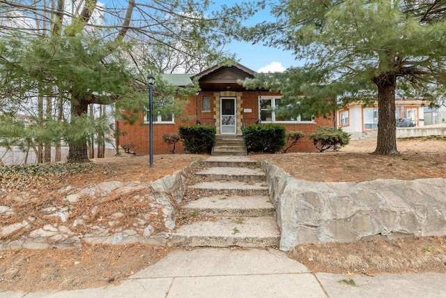 view of front of house with brick siding