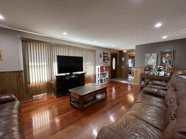 living area featuring recessed lighting, wainscoting, visible vents, and wood finished floors