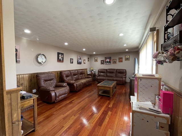 living room with recessed lighting and wood finished floors