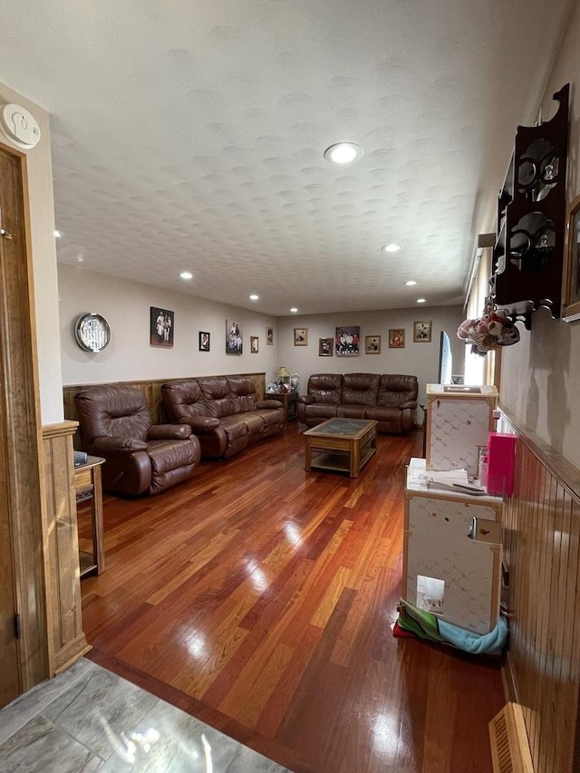 living room featuring recessed lighting and wood finished floors