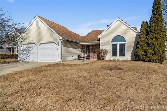 ranch-style house featuring a front lawn, concrete driveway, an attached garage, a shingled roof, and brick siding