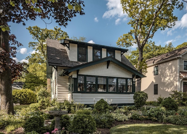 421 Dodson St, Geneva, IL 60134 - rear view of house with a sunroom and a shingled roof