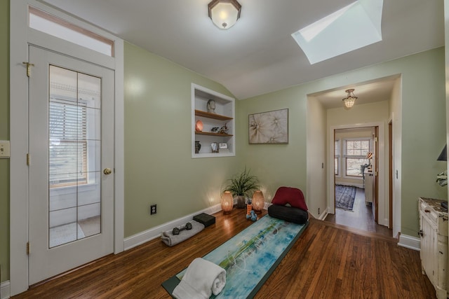 421 Dodson St, Geneva, IL 60134 - living area with a skylight, dark wood-style flooring, baseboards, and built in shelves