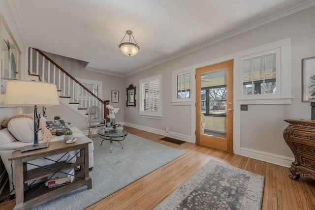 421 Dodson St, Geneva, IL 60134 - foyer featuring ornamental molding, stairs, baseboards, and wood finished floors