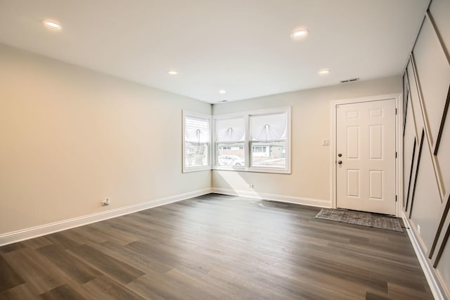 entrance foyer with recessed lighting, dark wood-style floors, visible vents, and baseboards