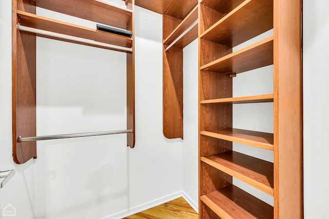 spacious closet with wood finished floors