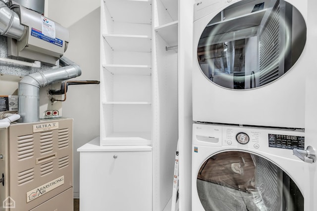 laundry area featuring laundry area and stacked washer and clothes dryer