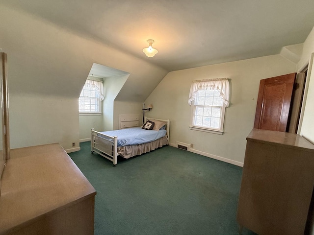 carpeted bedroom featuring visible vents, baseboards, and vaulted ceiling