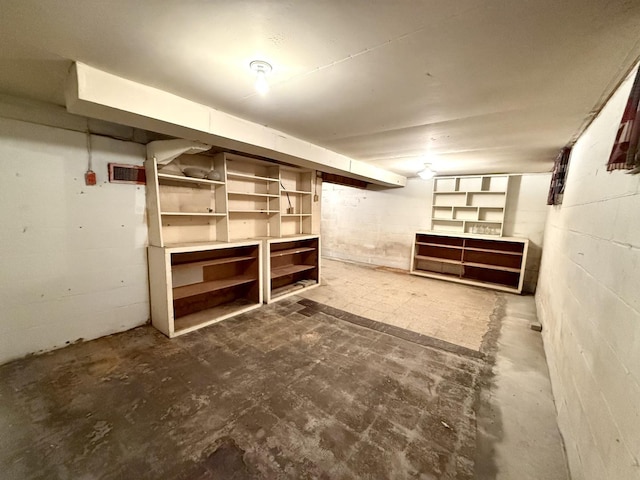 finished basement with concrete block wall