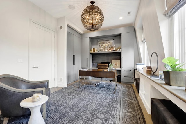 home office with an inviting chandelier, recessed lighting, and visible vents