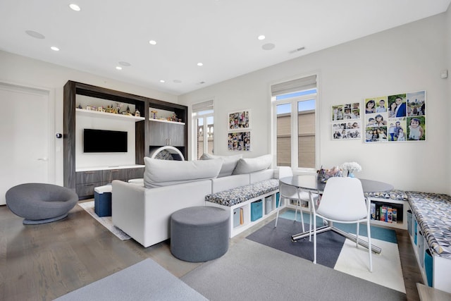 living area with breakfast area, visible vents, wood finished floors, and recessed lighting