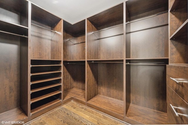 77 E Walton Pl Unit 24E, Chicago, IL 60611 - walk in closet featuring wood finished floors
