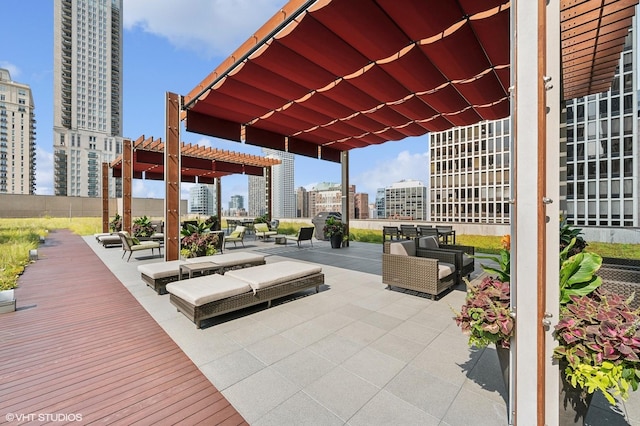 view of patio with a city view and a pergola