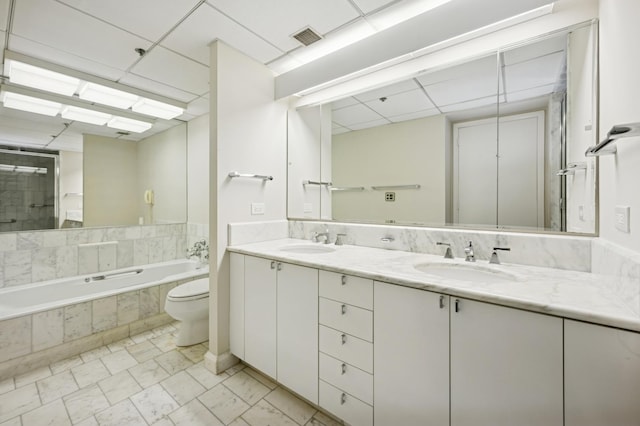 full bathroom with a sink, visible vents, a paneled ceiling, and a relaxing tiled tub