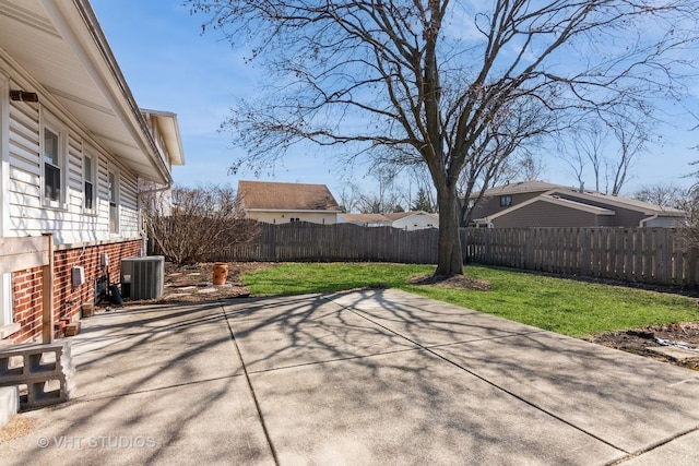 view of patio with central air condition unit and a fenced backyard