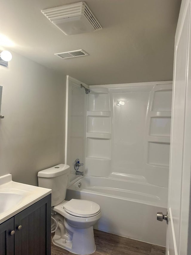 121 S Annandale Dr, Lake In The Hills, IL 60156 - full bath featuring visible vents, shower / washtub combination, toilet, wood finished floors, and vanity