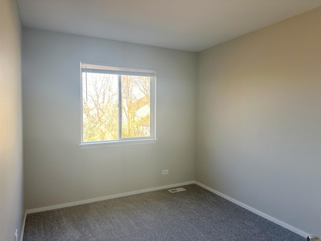 121 S Annandale Dr, Lake In The Hills, IL 60156 - unfurnished room with visible vents, baseboards, and dark carpet