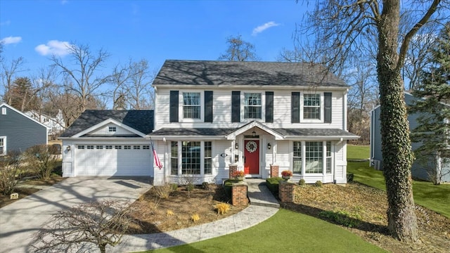 view of front of home featuring a garage, roof with shingles, concrete driveway, and a front lawn