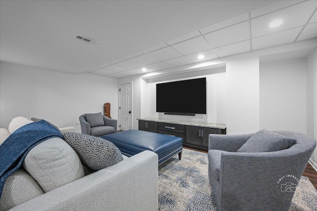 living room featuring visible vents, recessed lighting, a paneled ceiling, and wood finished floors