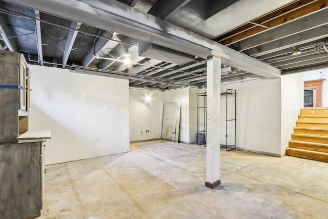 unfinished basement featuring stairs