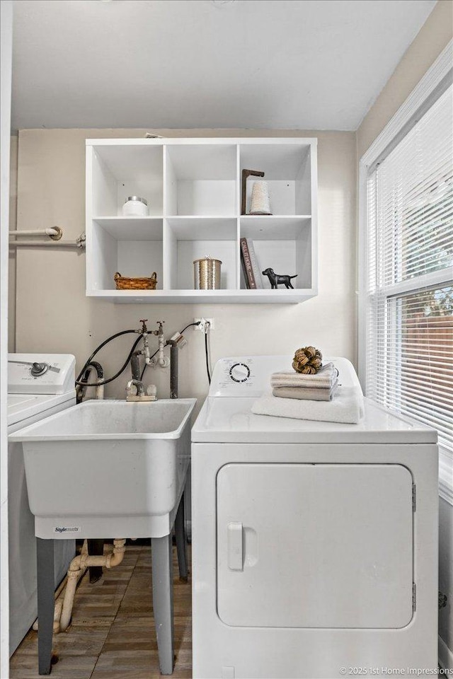 washroom featuring laundry area and a sink