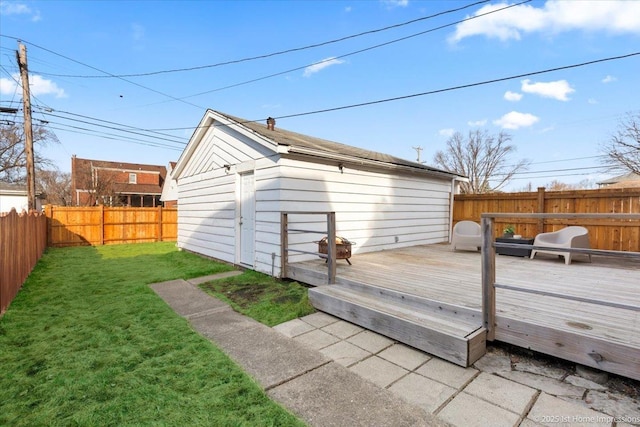 exterior space with an outbuilding and a fenced backyard