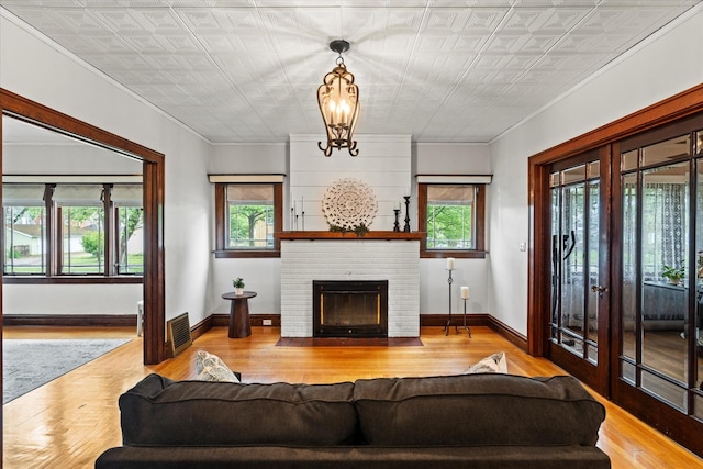 896 S Myrtle Ave, Kankakee, IL 60901 - living area featuring an ornate ceiling, ornamental molding, wood finished floors, baseboards, and a fireplace