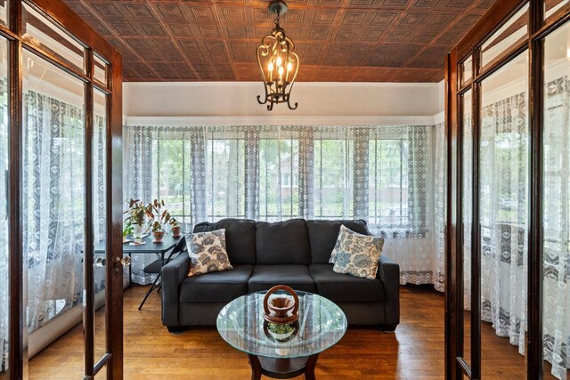 896 S Myrtle Ave, Kankakee, IL 60901 - sunroom / solarium featuring an ornate ceiling, wood finished floors, and a chandelier