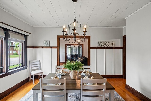 896 S Myrtle Ave, Kankakee, IL 60901 - dining area featuring a chandelier, wood finished floors, crown molding, and baseboards