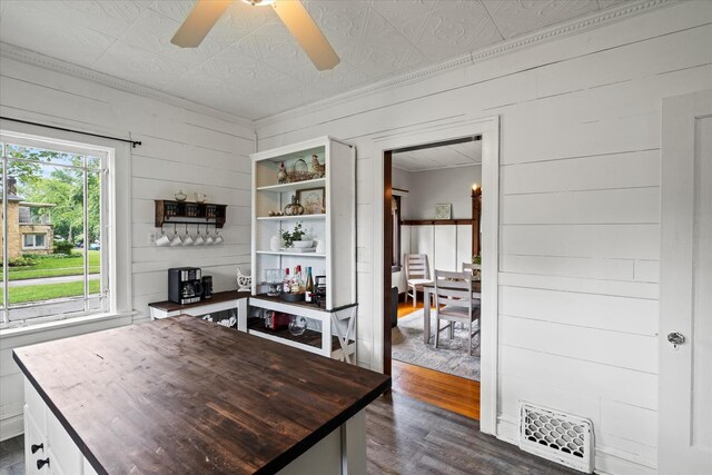 896 S Myrtle Ave, Kankakee, IL 60901 - bar with an ornate ceiling, dark wood-type flooring, wooden walls, a ceiling fan, and ornamental molding
