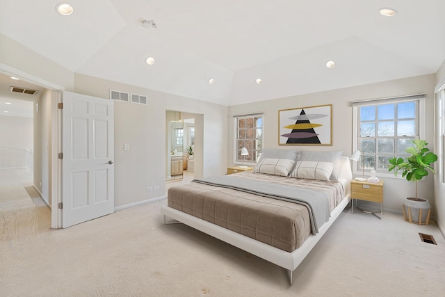 bedroom featuring lofted ceiling, light colored carpet, and visible vents