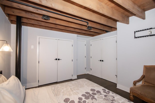 interior space featuring beamed ceiling and wood finished floors