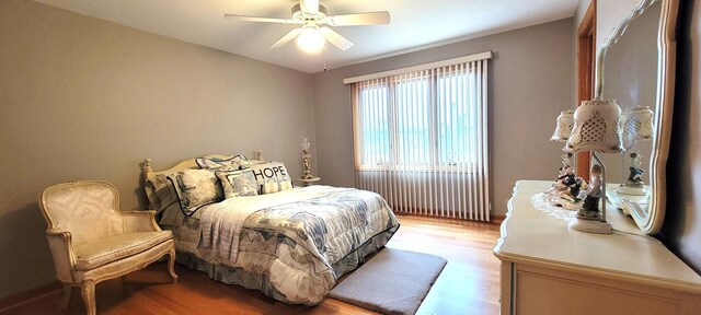 bedroom featuring light wood-style flooring and ceiling fan