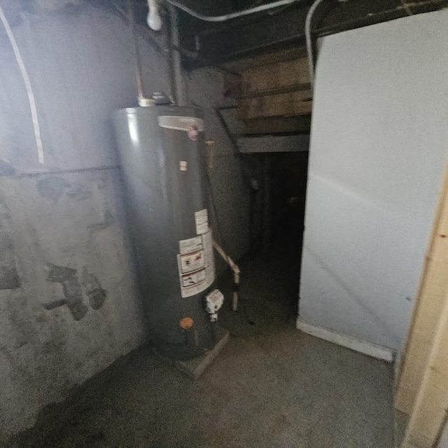 utility room featuring water heater