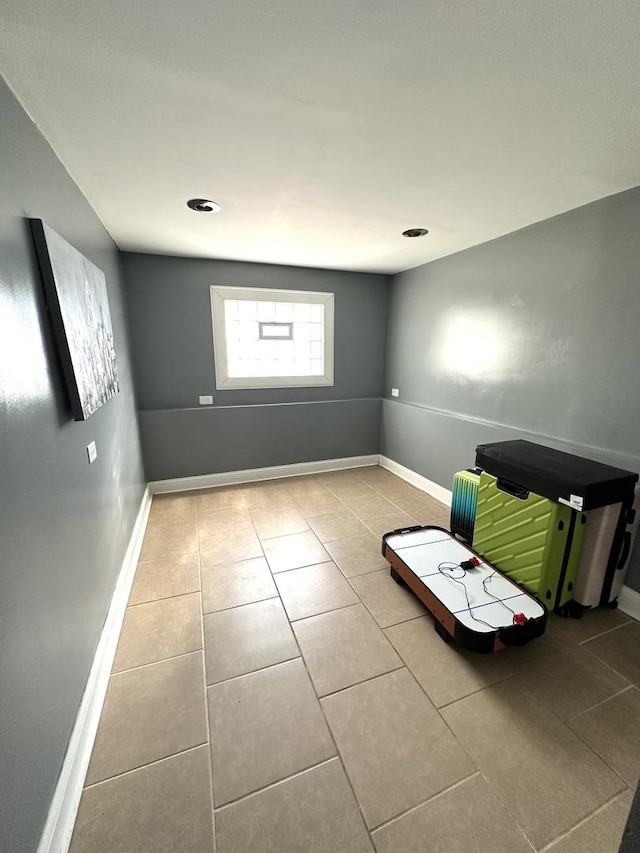 tiled spare room with baseboards