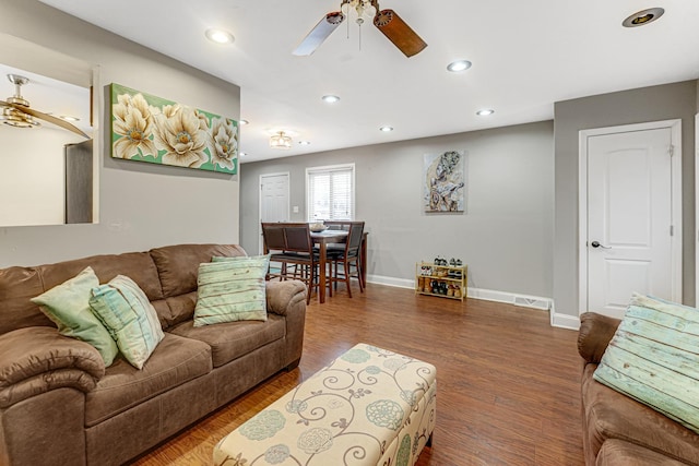 living room featuring recessed lighting, baseboards, ceiling fan, and wood finished floors