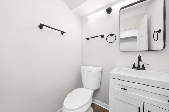 2077 Lioncrest Dr, Richton Park, IL 60471 - bathroom featuring baseboards, toilet, wood finished floors, and vanity
