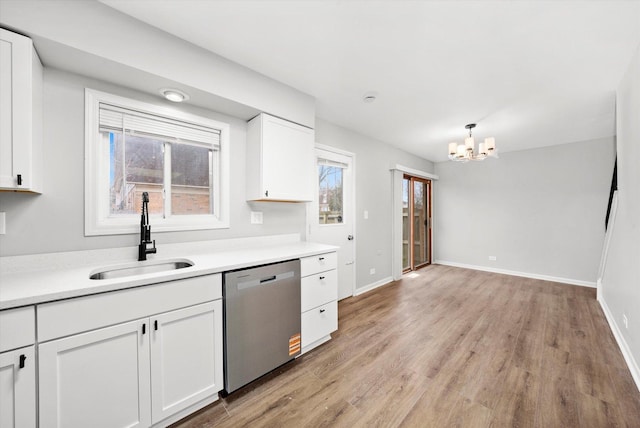 2077 Lioncrest Dr, Richton Park, IL 60471 - kitchen with a sink, baseboards, stainless steel dishwasher, and white cabinets