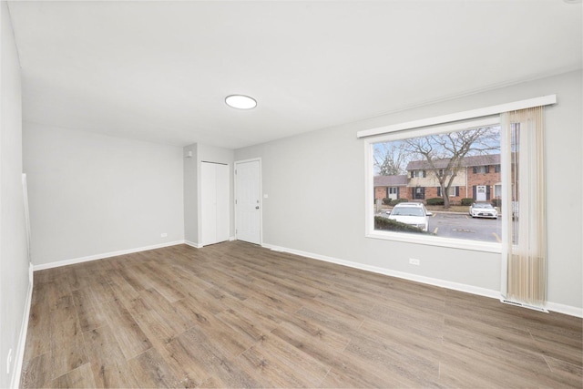 2077 Lioncrest Dr, Richton Park, IL 60471 - unfurnished room with baseboards and wood finished floors